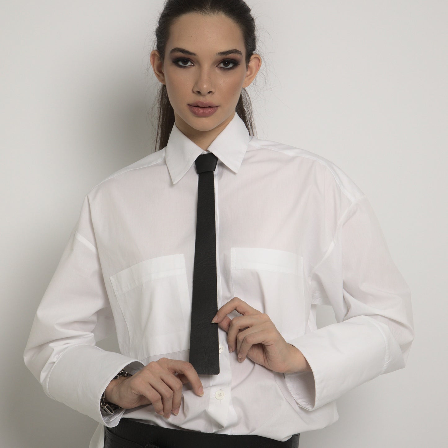 Leather tie with metal fastening